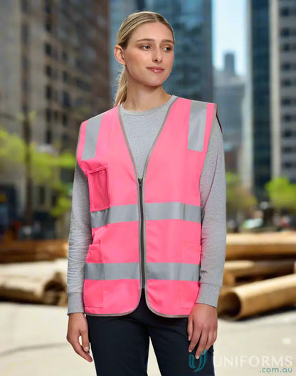 Woman in sw04 hi-vis safety vest with utility pockets from Winning Spirit Unisex