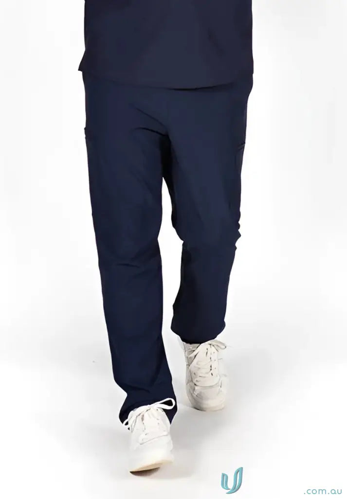 Navy blue Medi 8 Unisex Scrub Pants with white athletic shoes for comfy unisex scrub look