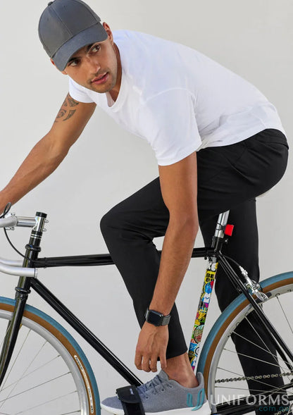 Man on bicycle wearing Venture Pant from Biz Collection Men’s collections venture lineup