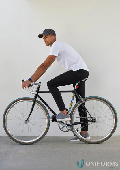 Man riding a black bicycle in Biz Collection Mens Venture Pant collection