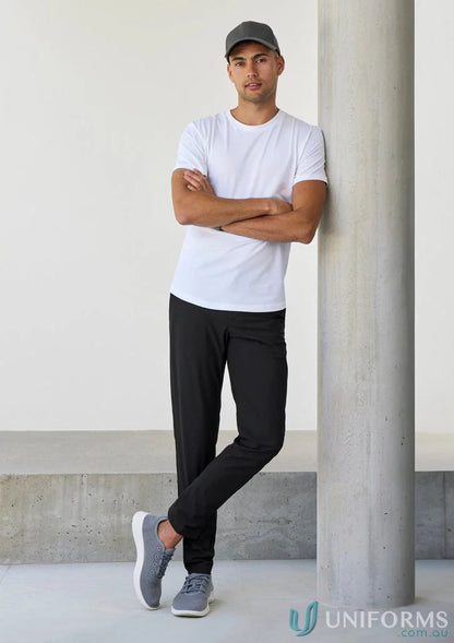 Man in casual athletic wear showcasing Venture Pant from Biz Collection Men’s collections Venture