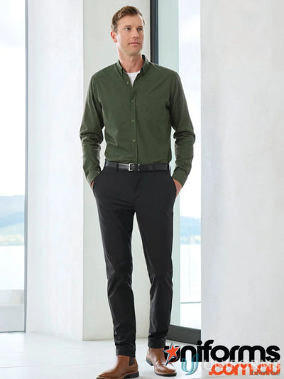 Man wearing Venture Pant from Biz Collection Men’s collections venture in green shirt and black pants