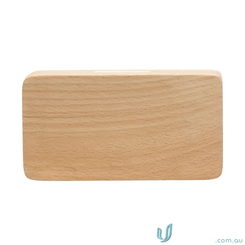 Light-colored wooden block with rounded edges from VersaGrip Multi Tool stainless steel drop blade