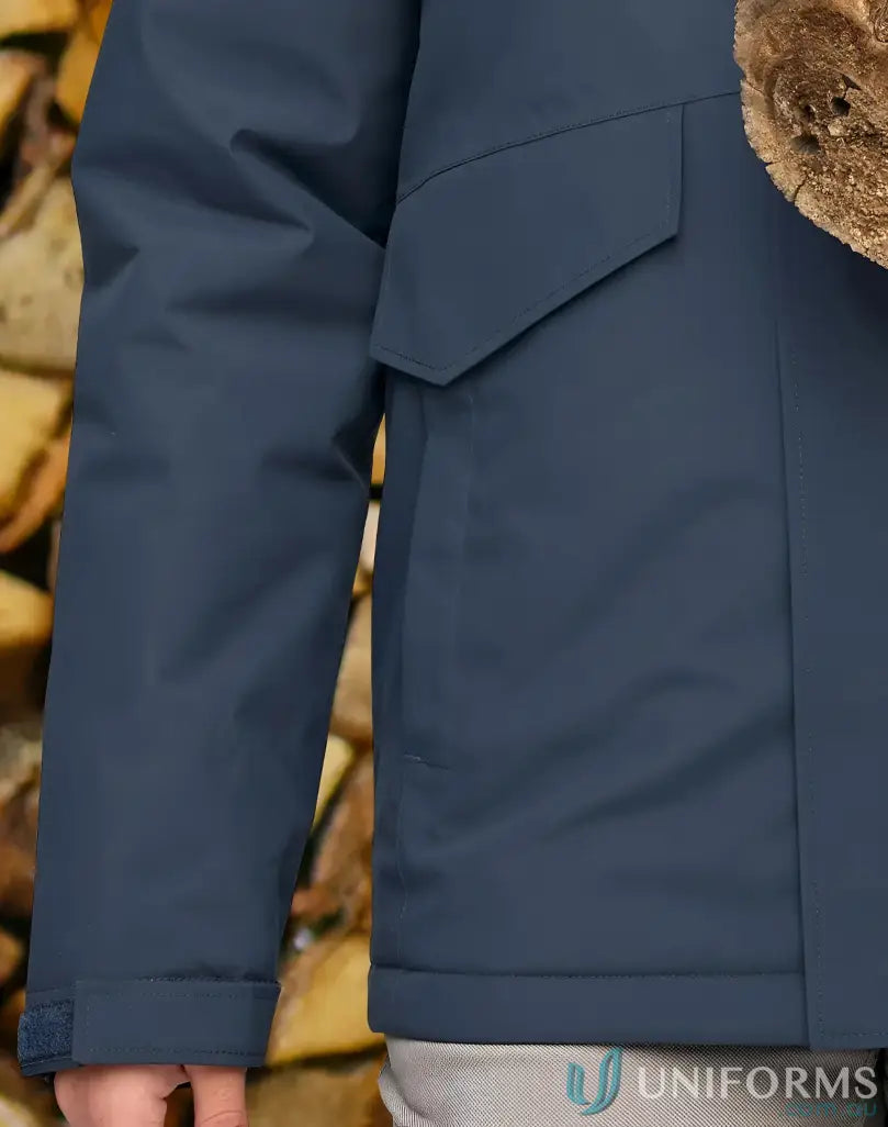 Dark blue Vic Metro Waterproof Quilted Jacket with fur-lined hood and flapped pocket