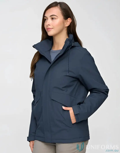 Woman wearing Vic Metro Waterproof Quilted Jacket with hood and large front pockets