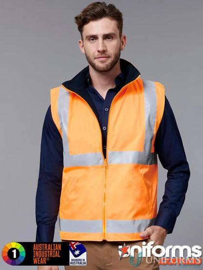 Man wearing VIC Rail Reversible Safety Vest with reflective stripes over dark blue shirt