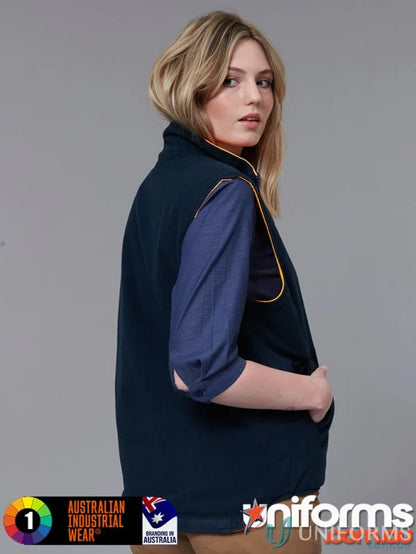 Woman wearing VIC Rail Reversible Safety Vest with dark blue polar fleece and yellow piping