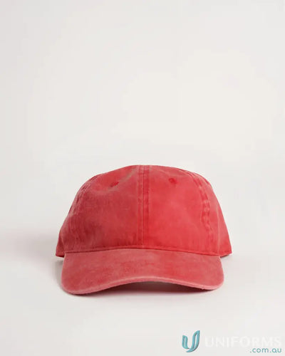 Coral suede baseball cap with adjustable strap and button closure.