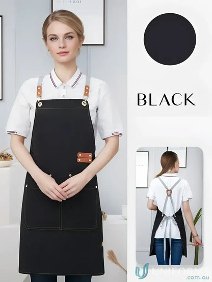 Black waterproof canvas kitchen apron with brown leather accents and front pockets