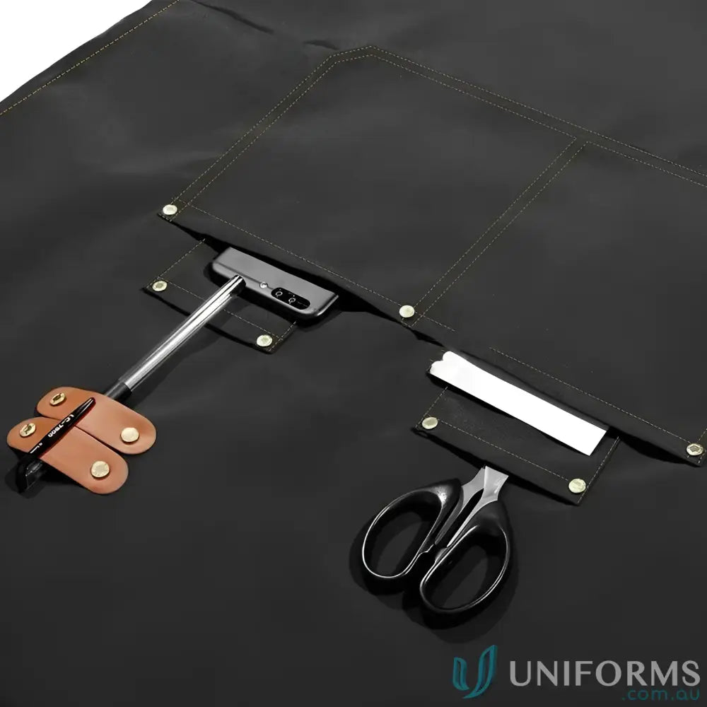 Black waterproof canvas kitchen apron with multiple pockets and tool loops in vibrant colors