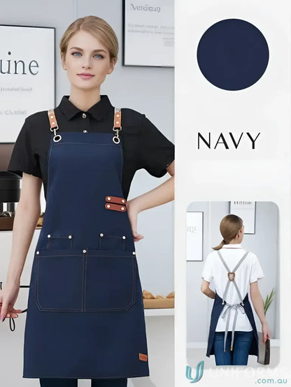 Navy blue waterproof canvas kitchen apron with leather straps and front pockets
