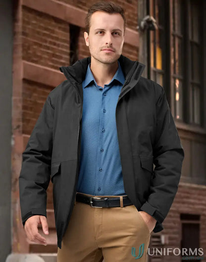 Man in waterproof quilted jacket and workwear staying dry in uniforms