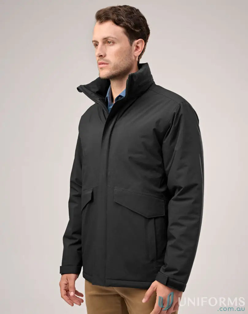 Man in Waterproof Quilted Jacket staying dry in workwear with front pockets