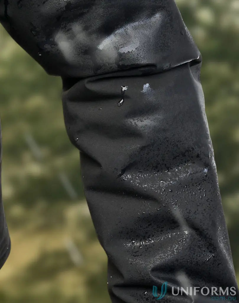 Water-resistant black fabric sleeve on Waterproof Quilted Jacket to stay dry in workwear