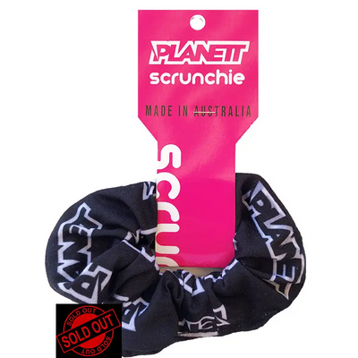 Black planet scrunchie with white and gray planet lettering on elastic fabric perfect for work uniforms and workwear