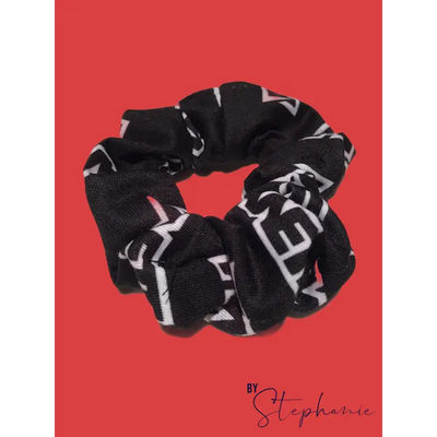 Black scrunchie with bold white geometric lettering perfect for adding style to uniforms and workwear looks