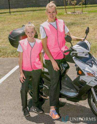Two people in pink Winning Spirit AIW HiVis 120gsm safety vests next to a scooter