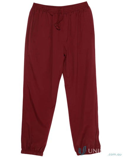 Winning Spirit Kids Legend Warm Up Pants with maroon color and zip-up leg openings