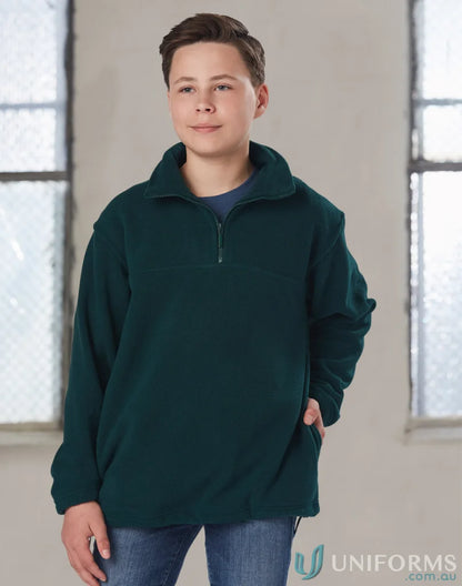 Boy in a green Buller Polar Fleece kids Mt Buller fleece jumper for cozy winter style