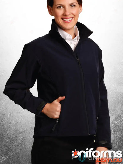 Woman in dark blue Winning Spirit Ladies HiTech Softshell Jacket with white shirt and black skirt