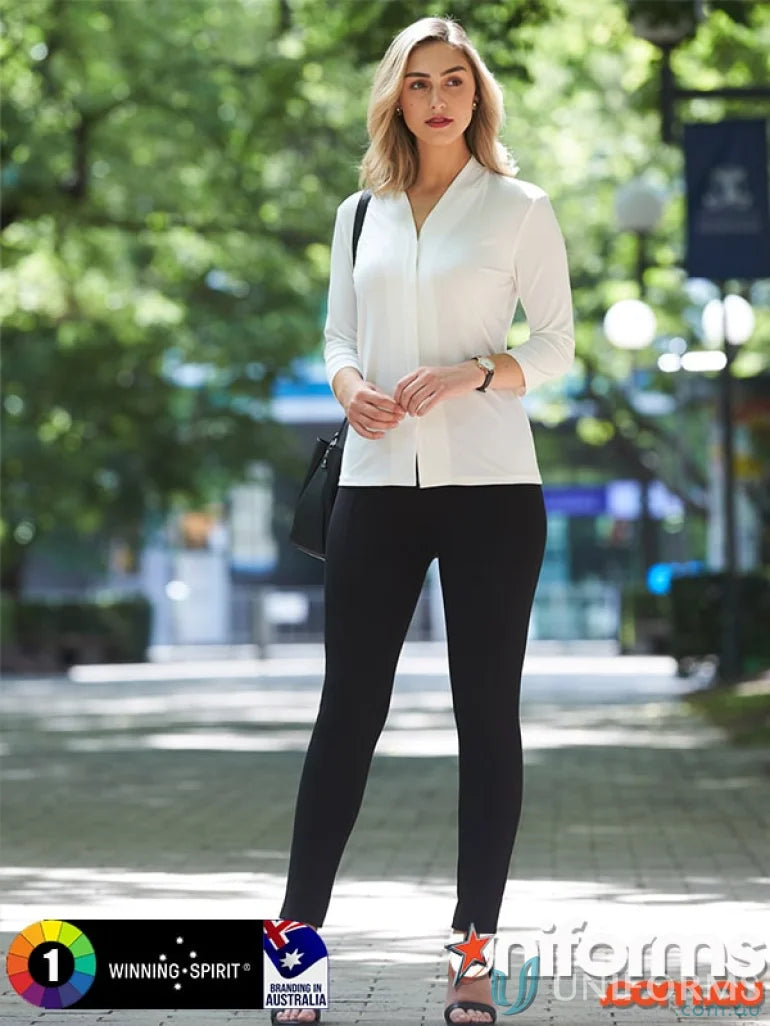 Woman in white blouse and black leggings wearing Winning Spirit Ladies London Treggings