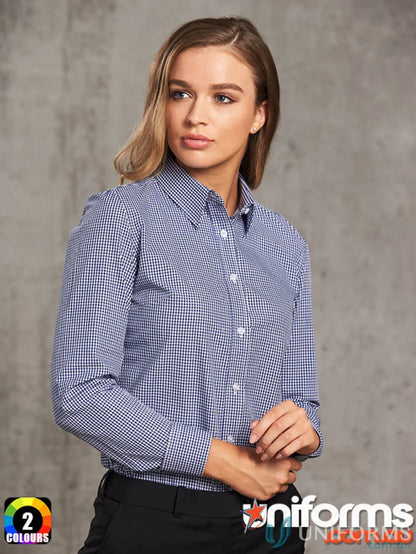 Woman wearing Winning Spirit Ladies’ multi-tone check long sleeve shirt in blue and white