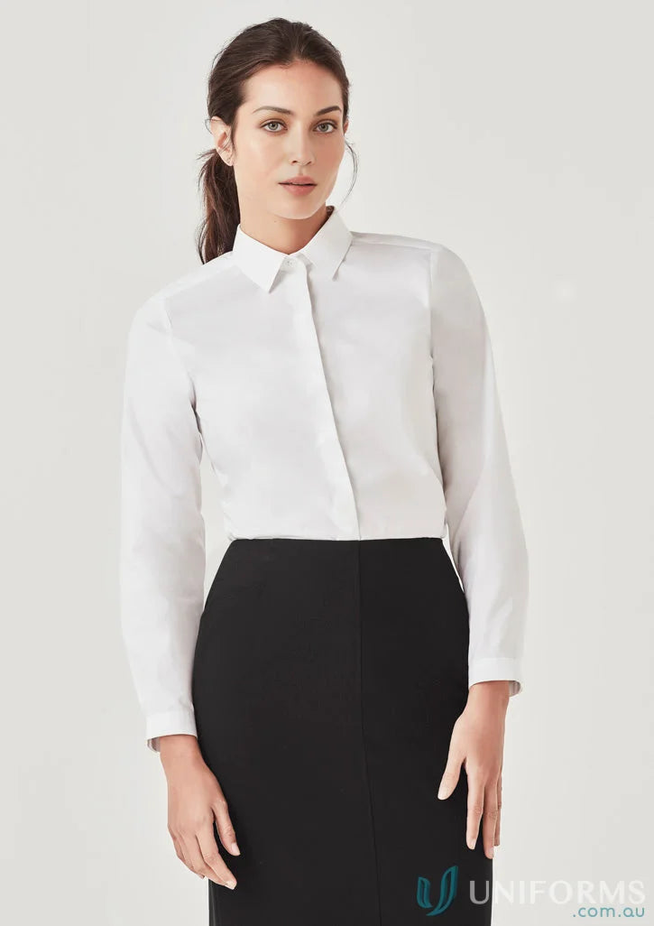 Woman in white blouse and black skirt wearing Womens Charlie LS Shirt, a stylish long sleeve shirt