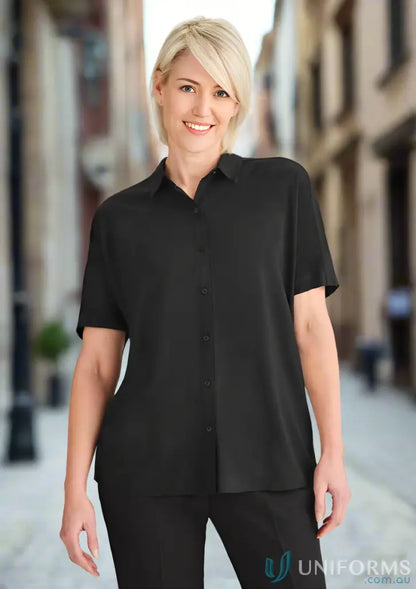 Smiling woman in women’s Dahlia Short Sleeve Blouse looking effortlessly elegant