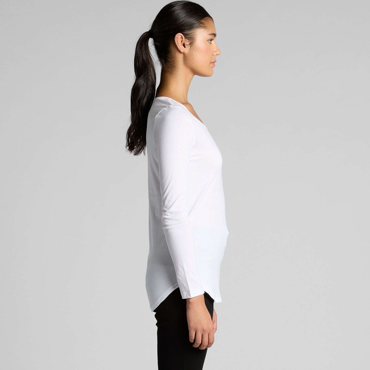 White lightweight scoop neck LS tee with high-low hem and black leggings