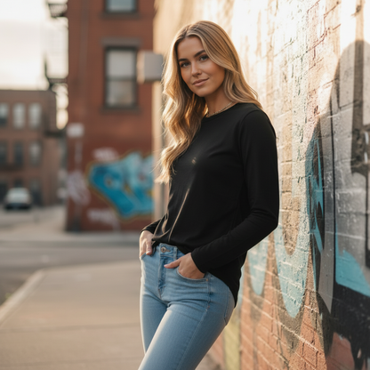 Women’s Maple Curve long sleeve tee with black crewneck, light blue jeans