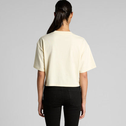 Cream-colored Martina Crop Tee with minimalist design and black pants
