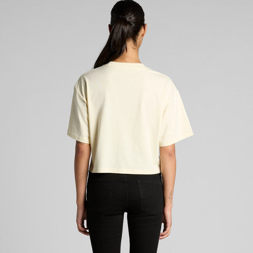Cream-colored Martina Crop Tee with minimalist design and black pants