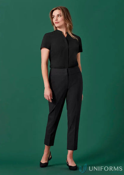 Woman modeling Womens Renew mid-waist slim recycled polyester pants with black shirt and flats