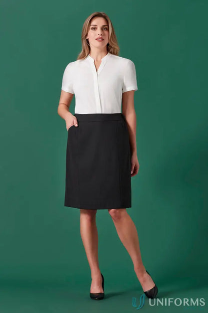 Woman modeling women’s renew functional pencil skirt with white blouse for day long style