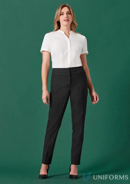 Woman wearing Womens Renew Mid-Waist Slim Leg Pants with a white shirt and black heels