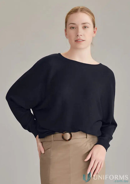 Woman in Navy Skye Batwing Sweater Top with Tan Skirt for Creative Industries style