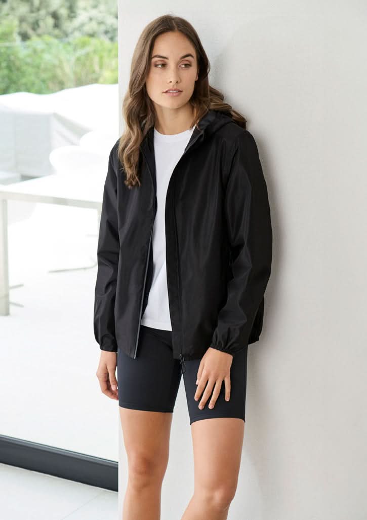 Woman in black jacket and shorts showing Womens Tempest Jacket with biz tech waterproof tech breathability rating