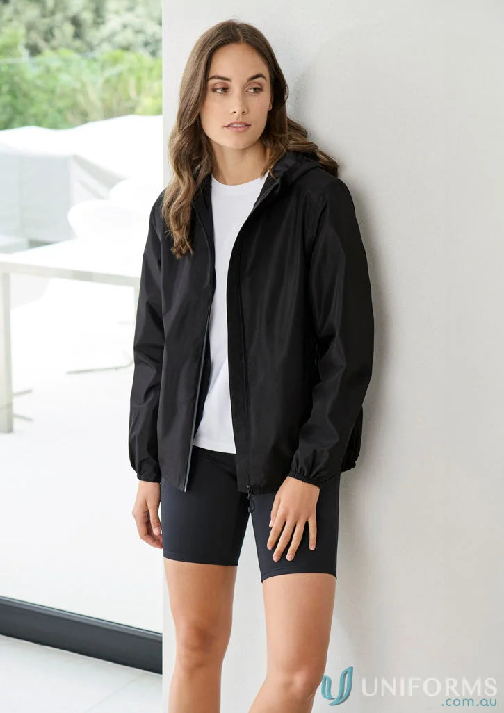 Woman in black jacket and shorts showing Womens Tempest Jacket with biz tech waterproof tech breathability rating