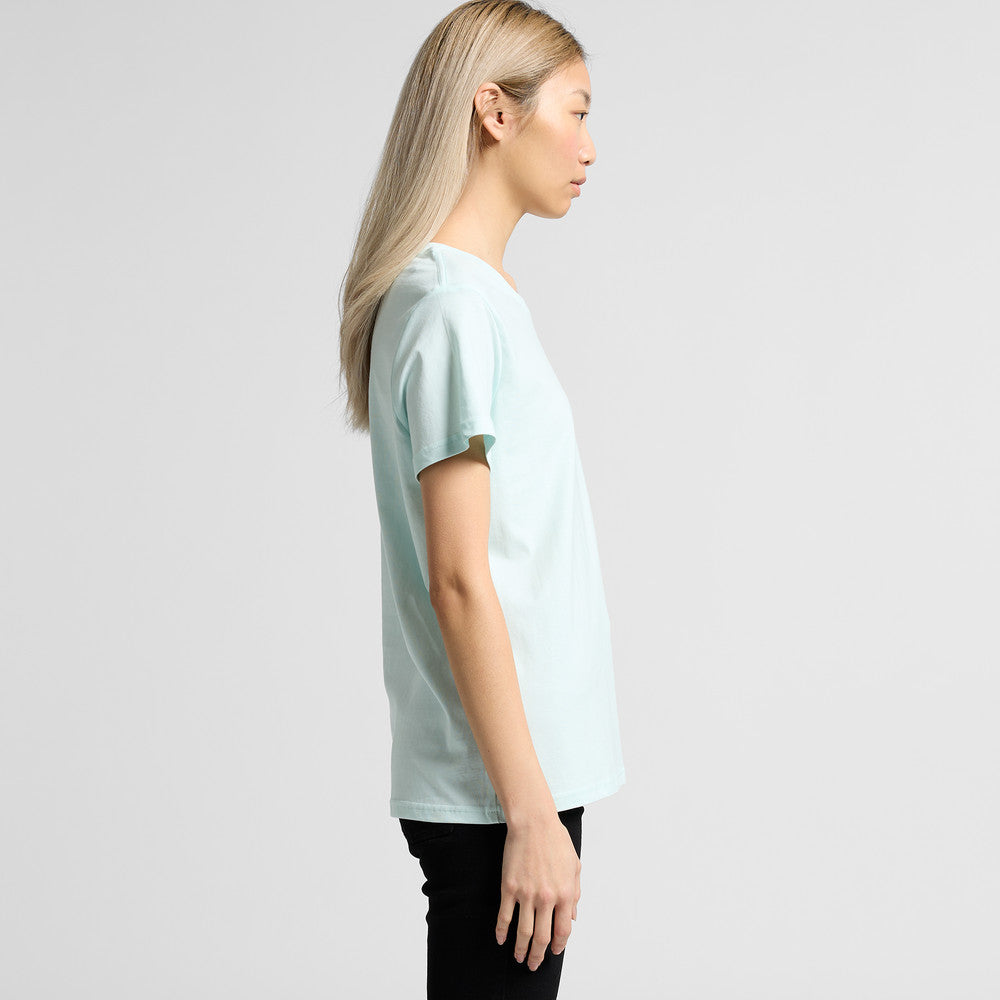 Woman in versatile maple tee: light blue oversized t-shirt, black pants, long blonde hair