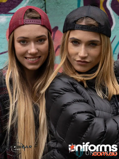 Two women wearing Wood Printed Trucker Mesh Caps with a high wide imprint look cool