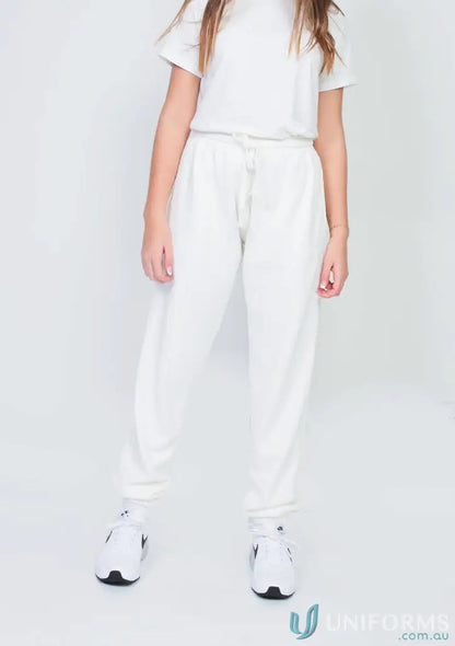 White sweat suit with sneakers showcasing Youth Track Pant Black, perfect for youth track days