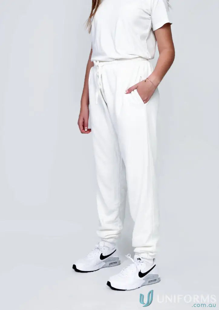 White sweatpants and sneakers outfit featuring Youth Track Pant Black for a chill youth look