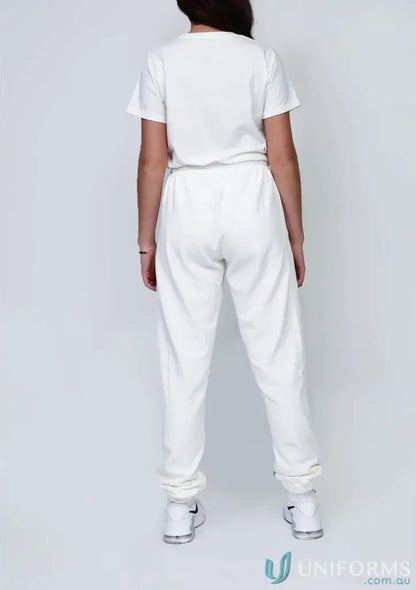 Youth track pant black outfit featuring a white t-shirt and sweatpants for casual style