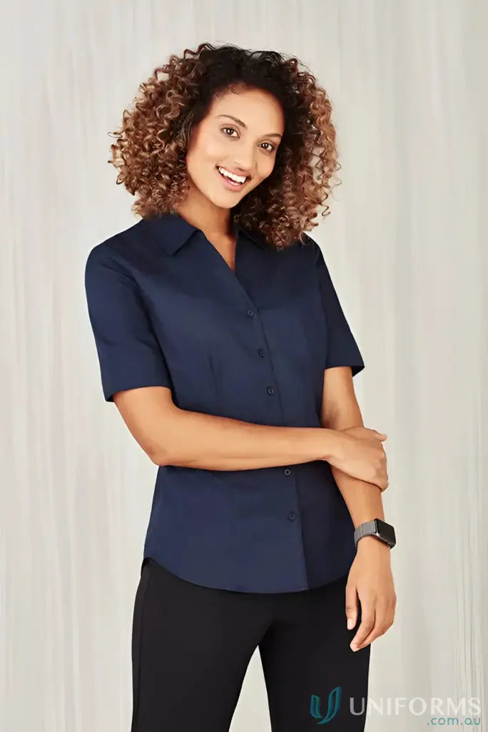 Woman wearing navy short-sleeved button-down shirt from YR Ladies EMb SS Shirt, women’s Monaco style