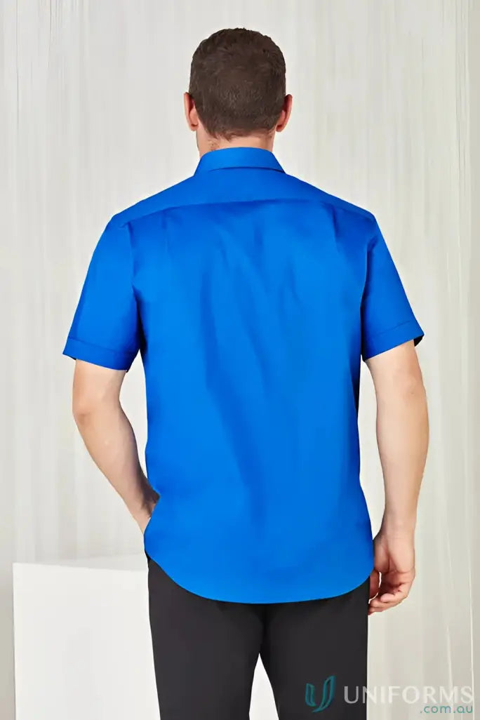 Man wearing a bright blue YR Mens EMB SS Shirt, perfect monaco short sleeve shirt offers