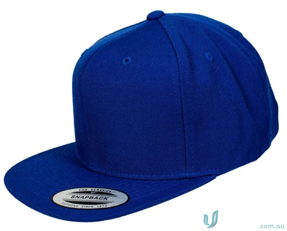 Blue flat-brimmed snapback cap from Yupoong Classic Workwear collection perfect for uniforms