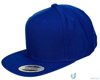 Blue flat-brimmed snapback cap from Yupoong Classic Workwear collection perfect for uniforms
