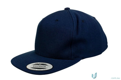 Navy blue classic snapback cap perfect for uniforms and workwear from Yupoong