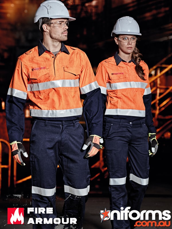 A man and a lady in hardhats with the lady wearing Women’s FR Closed Front Hooped Taped Spliced Shirt ZW131!