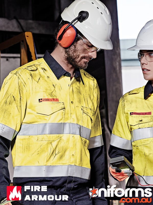 Two men stand together while working wearing the Syzmic Men’s Red Flame Hi-Vis Shirt!